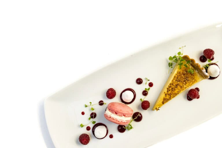 A white plate with a piece of dessert on it.