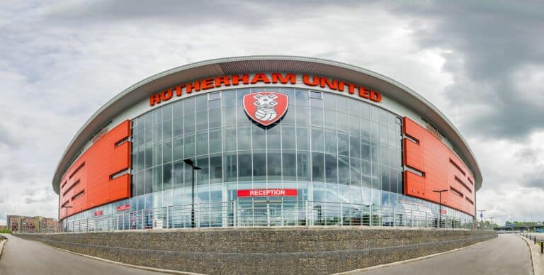 A building with an orange and white sign.