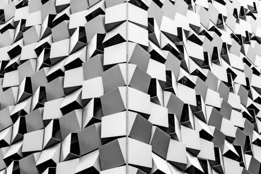 A black and white photo of a building with geometric shapes.