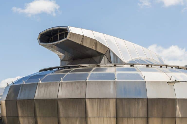 A large building with a metal roof.