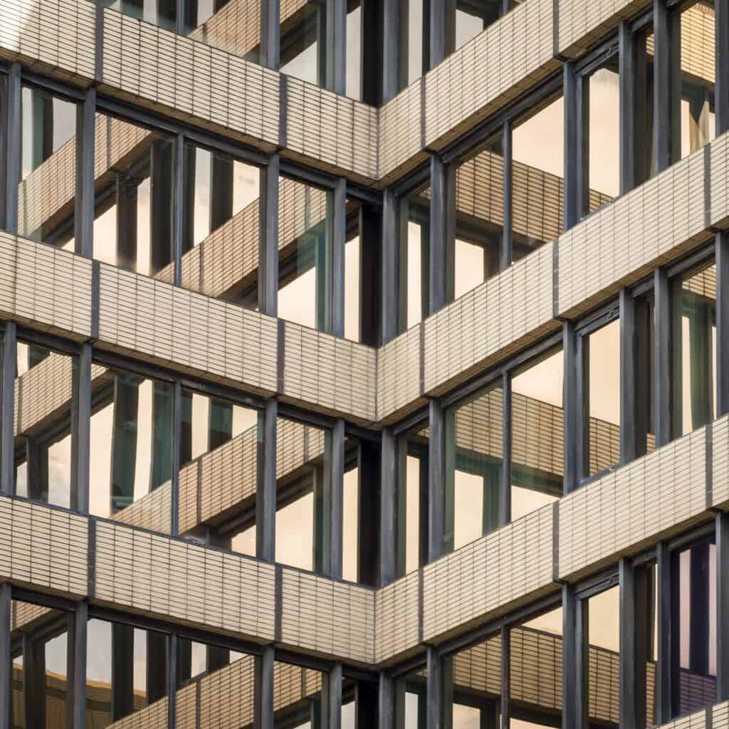 A close up of a building with many windows.