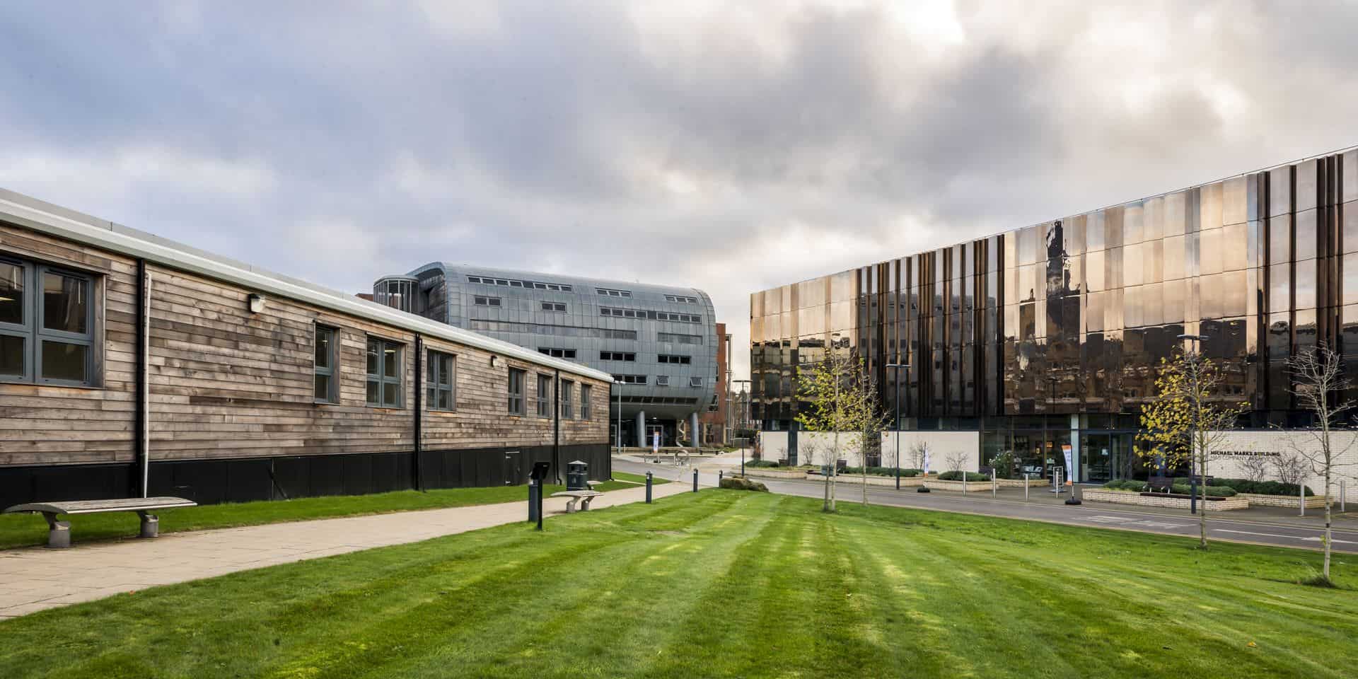 A building with a grassy area in front of it.