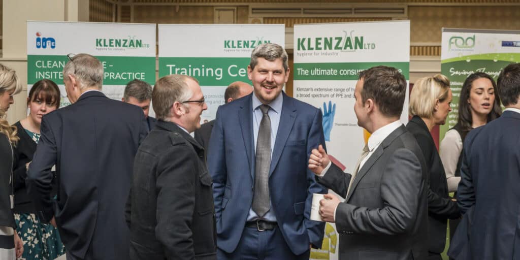 A group of people talking at a training event.