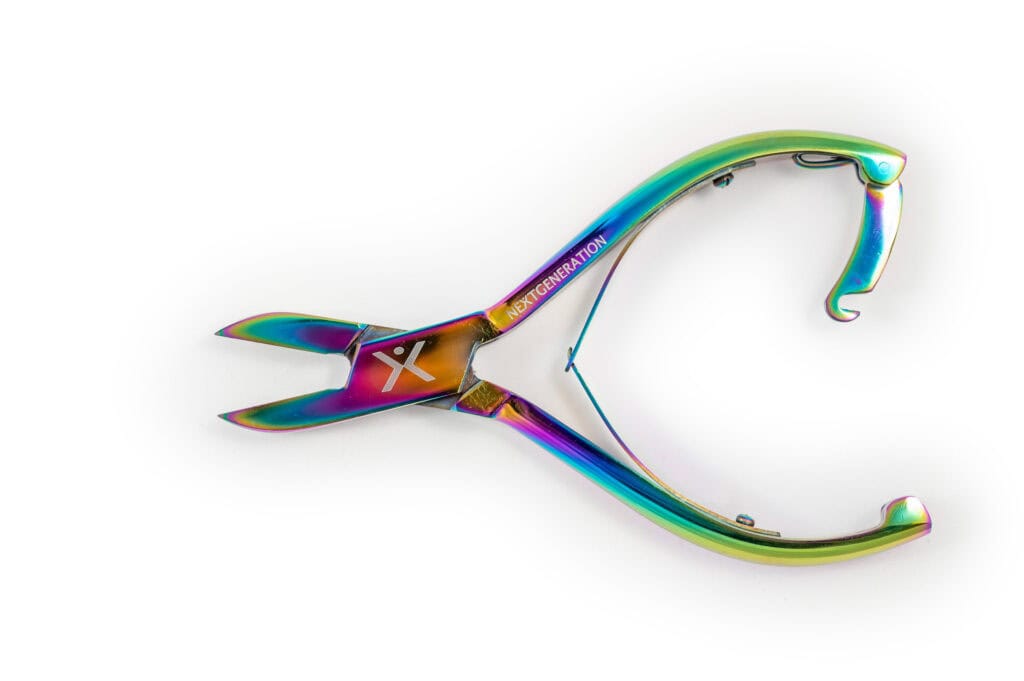 A rainbow colored pair of scissors on a white background.